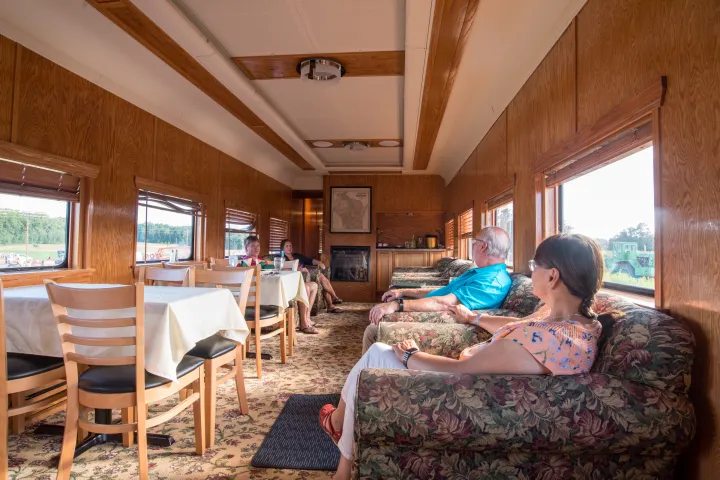 a living room filled with furniture and a large window