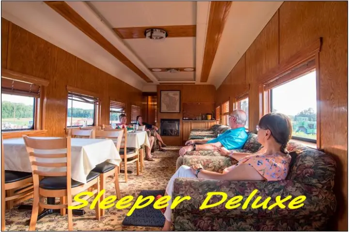 a person sitting at a table in front of a window