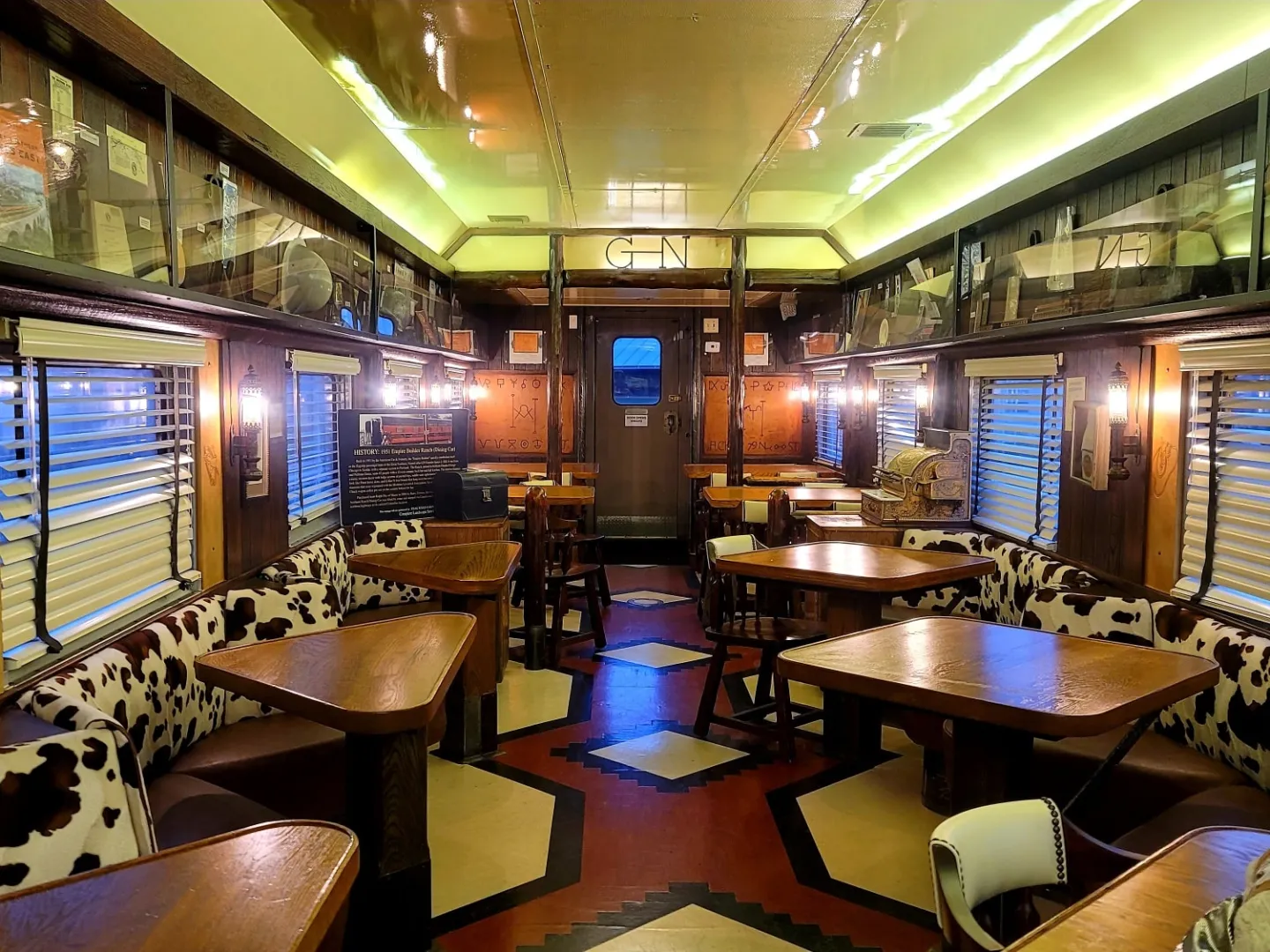 an office with a desk and chair in a room