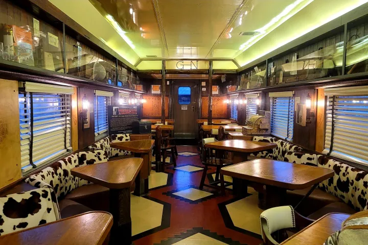 an office with a desk and chair in a room